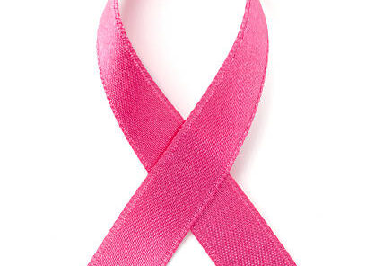 pink breast cancer awareness ribbon on white.